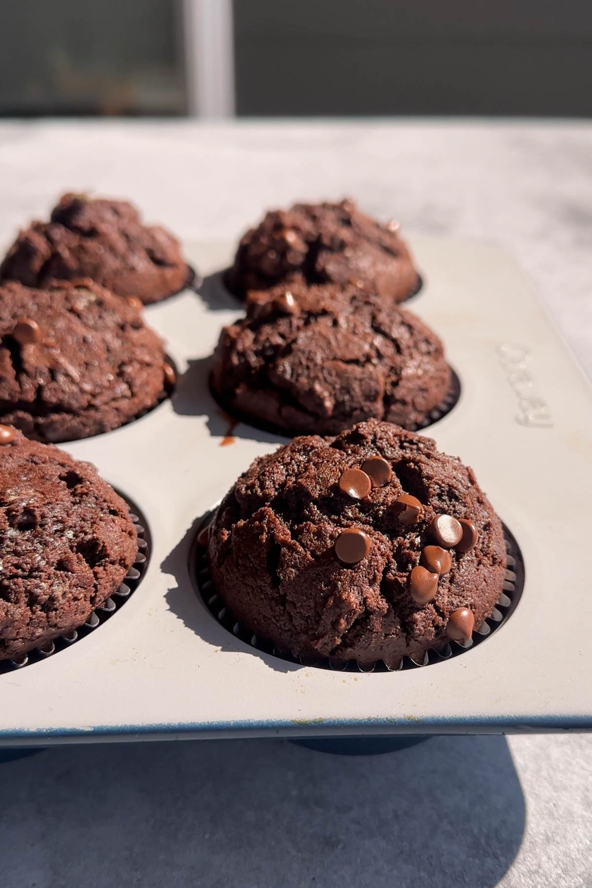 Olympic Village chocolate muffins baked in a muffin pan